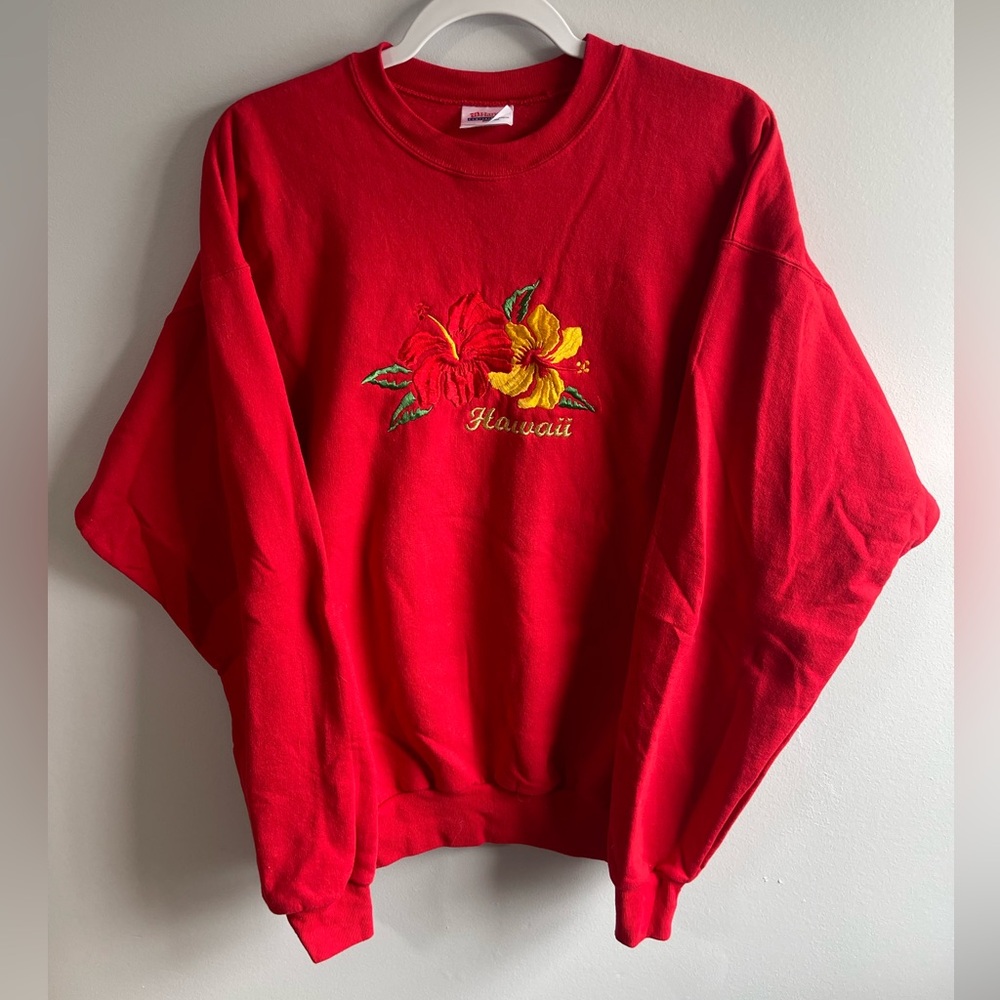 vintage red Hanes brand crewneck sweatshirt featuring Hawaii floral embroidery